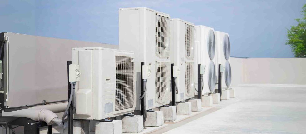 Rooftop row of heating and cooling condenser units